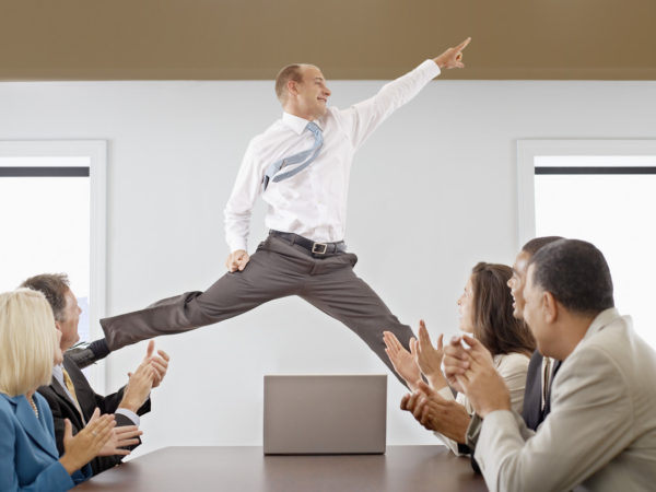 Businessman Midair in a Business Meeting --- Image by © Royalty-Free/Corbis