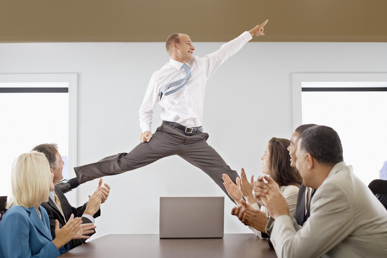 Businessman Midair in a Business Meeting --- Image by © Royalty-Free/Corbis